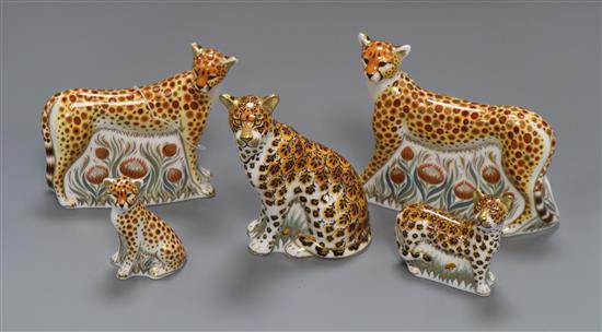 Five Royal Crown Derby paperweights - three cheetahs, leopard cub and leopardess